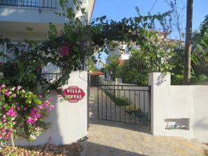 a gate to a house with flowers on it at VillaSevval - Stunning 4-Bed Villa in Dalyan