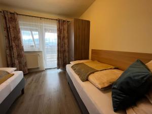 Posteľ alebo postele v izbe v ubytovaní Apartmány Friends Tatry