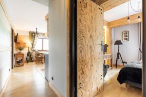 Łóżko lub łóżka w pokoju w obiekcie Apartament Natura Zakopane