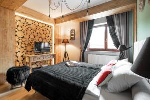 Łóżko lub łóżka w pokoju w obiekcie Apartament Natura Zakopane