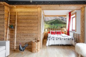 Łóżko lub łóżka w pokoju w obiekcie Apartament Natura Zakopane