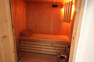 a wooden sauna with a bench in a room at La Haute Flourie - bed and breakfast -chambres d'hôtes in Saint Malo