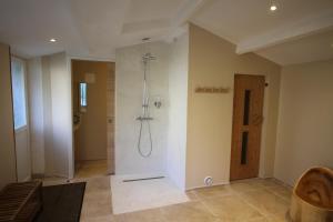 a bathroom with a shower in a room at La Haute Flourie - bed and breakfast -chambres d'hôtes in Saint Malo