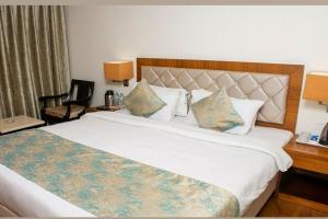 Een bed of bedden in een kamer bij Hotel Meadows