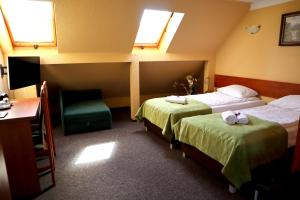 
Łóżko lub łóżka w pokoju w obiekcie Motel Arkadia
