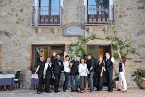 a group of people standing in front of a building at Nascar Hotel in Santa Maria Navarrese