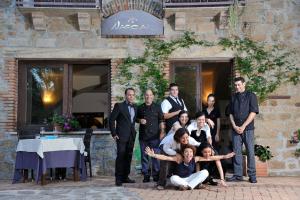 a group of people posing for a picture in front of a building at Nascar Hotel in Santa Maria Navarrese