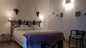 Postel nebo postele na pokoji v ubytování Masseria Fontana di Vite
