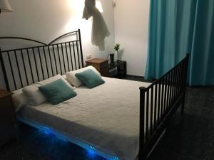 a bedroom with a bed with two pillows on it at Casa Paula in Yaiza +17 photos