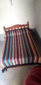 En eller flere senge i et værelse på ALOJAMIENTO SANTY