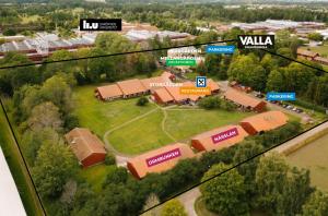 an aerial view of a school with buildings and trees at Valla Folkhögskola in Linköping