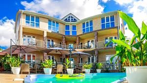 a large house with a pool in front of it at Villa Shell in Zatoka