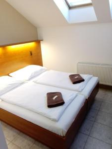 Postel nebo postele na pokoji v ubytování Beta Pension