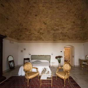 Postel nebo postele na pokoji v ubytování Masseria Fontana di Vite