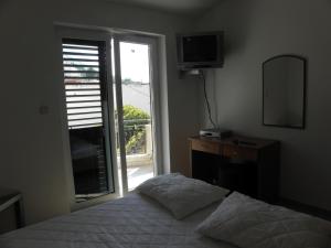 Posteľ alebo postele v izbe v ubytovaní Apartment in Podgora with sea view, terrace, air conditioning, WiFi 3812-4