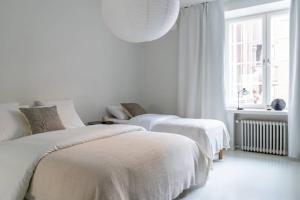 Llit o llits en una habitació de Spacious and central apartment with private sauna