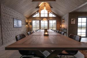 a large conference room with a large wooden table and chairs at Sälen Mountain Lodge in Sälen