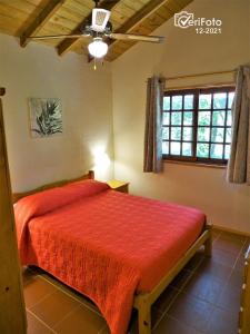 Villa Las Flores tesisinde bir odada yatak veya yataklar