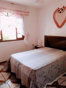 Ótima Casa para 10 pessoas /menos de 100m da Praia tesisinde bir odada yatak veya yataklar