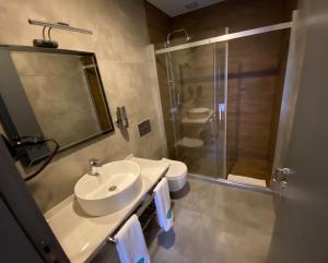 a bathroom with a sink and a shower at Antik Houses in Istanbul