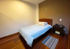 Cama o camas de una habitación en Apartasuites BellHouse Bogotá