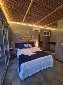 Un pat sau paturi într-o cameră la Club Manguaba Beira Mar