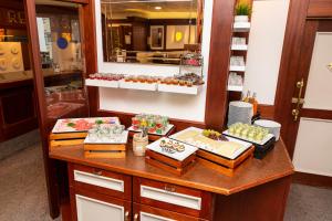 a buffet with many different types of food on a table at Königshof Bed and Breakfast in Königstein im Taunus