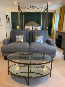 a living room with a couch and a coffee table at Lamlash Bay Hotel in Lamlash