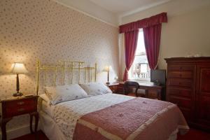 Llit o llits en una habitació de Virginia Lodge