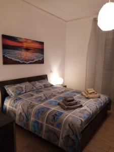 Säng eller sängar i ett rum på Appartamento Turistico "ortensia"
