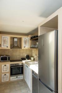 A kitchen or kitchenette at Melitia Traditional House