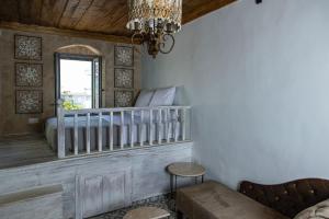 A bed or beds in a room at Melitia Traditional House