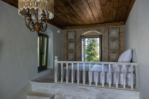A bed or beds in a room at Melitia Traditional House