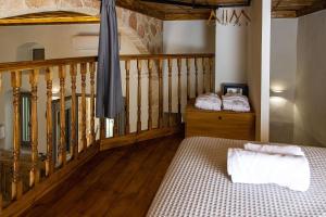 A bed or beds in a room at Melitia Traditional House
