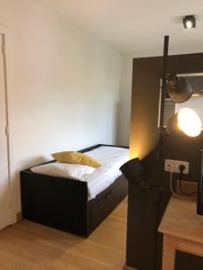 Postel nebo postele na pokoji v ubytování Hotel Le Cygne d'Argent