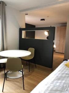 Postel nebo postele na pokoji v ubytování Hotel Le Cygne d'Argent