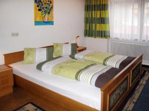 two beds sitting next to each other in a room at Apartment Elisabeth - ZAZ778 by Interhome in Aschau