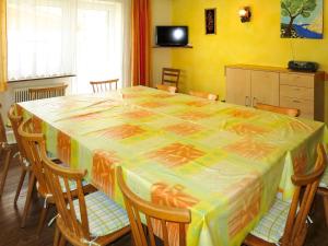 a table with a colorful table cloth on it in a room at Apartment Elisabeth - ZAZ778 by Interhome in Aschau