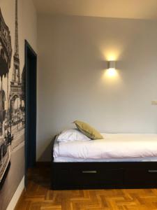 Postel nebo postele na pokoji v ubytování Hotel Le Cygne d'Argent