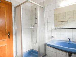 A bathroom at Apartment Piz Munschuns by Interhome