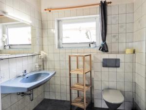 A bathroom at Apartment Piz Munschuns by Interhome