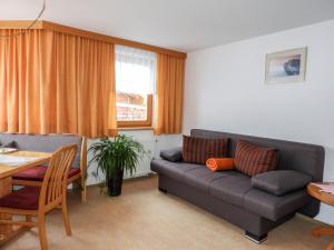 A seating area at Apartment Bergfeld-2 by Interhome