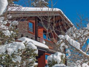 a house with snow on the roof of it at Chalet Château Lapin by Interhome in Verbier