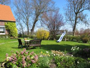 a park with a table and a playground with a slide at Apartment Harms by Interhome in Sankt Joost