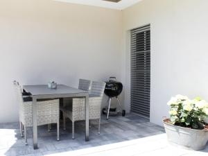 a dining room with a table and chairs at Holiday Home am Bächle by Interhome in Hofstetten