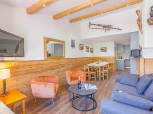 a living room with a couch and a table at Apartment Le Grand Tichot A et B - Val Claret-9 by Interhome in Tignes