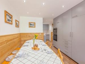 a kitchen and dining room with a table and chairs at Apartment Le Grand Tichot A et B - Val Claret-9 by Interhome in Tignes +20 photos