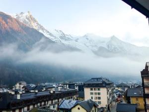 a view of a city with a mountain in the background at Apartment L'Outa by Interhome in Chamonix