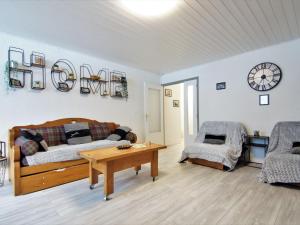 a living room with a couch and a table at Apartment L'Outa by Interhome in Chamonix-Mont-Blanc