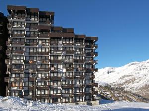 a tall building in the snow on a mountain at Apartment Home Club-1 by Interhome in Tignes